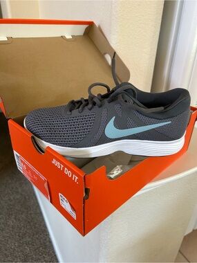 Nike Revolution 4 Women’s Gray Athletic Shoes with Light Blue Swoosh